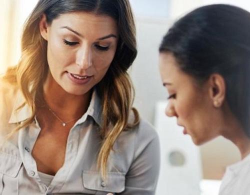 Psychiatric mental health nurse practitioner reviewing information with patient