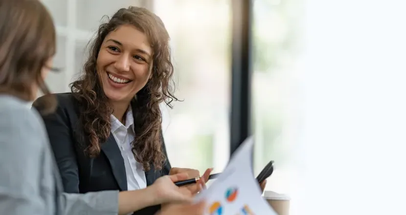 Project manager with bachelor's degree smiling during meeting